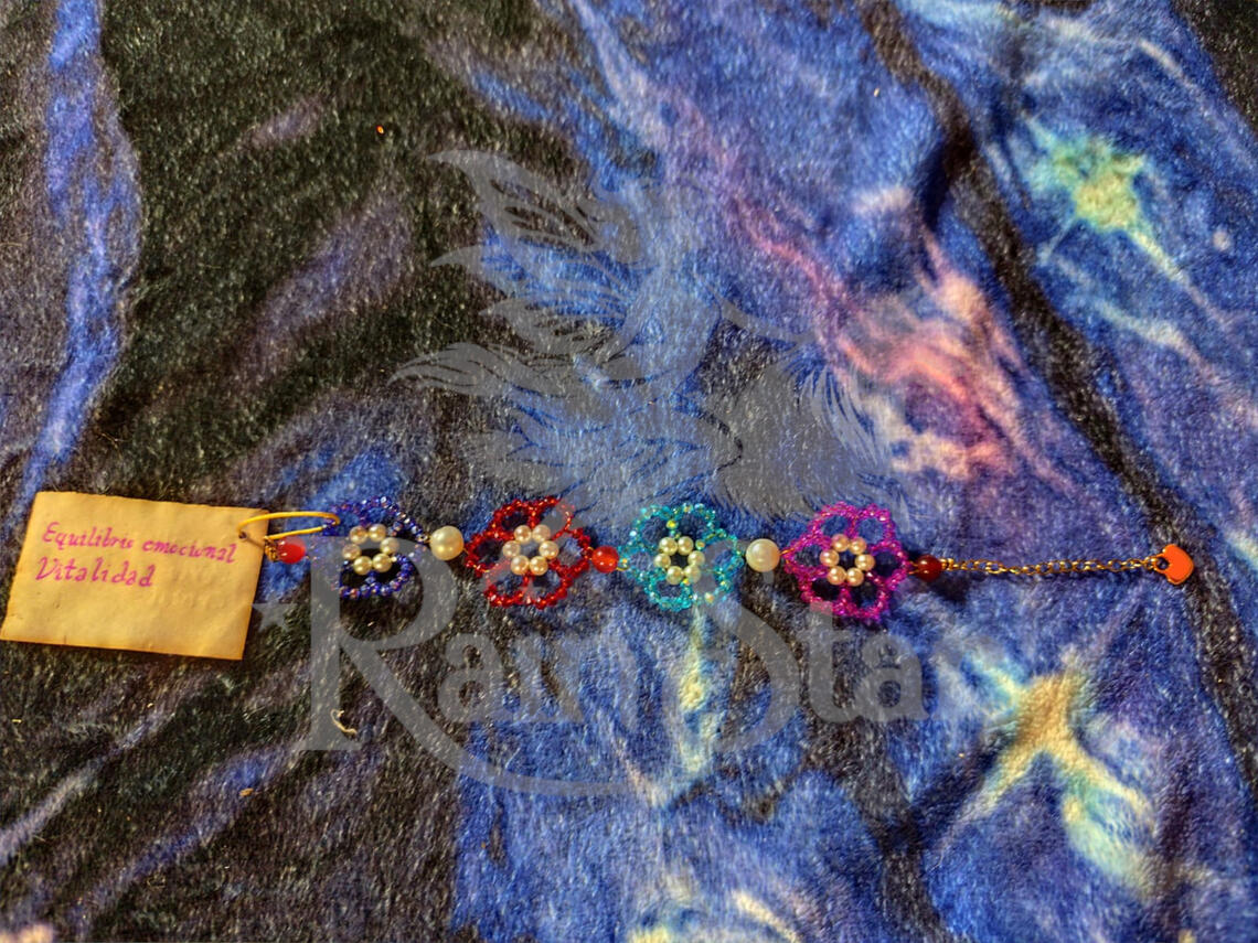 A beautiful floral bracelet, hand woven from jeweler's wire, featuring high-quality glass beads, cultured pearls and carnelian to help boost energy and vitality and balance emotions.