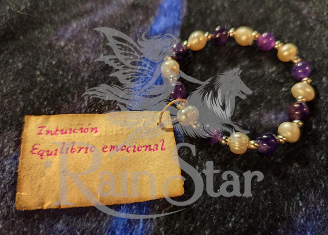 A handcrafted bracelet combining amethyst, hematite, and cultured pearls, created to support intuitive awareness and emotional balance.